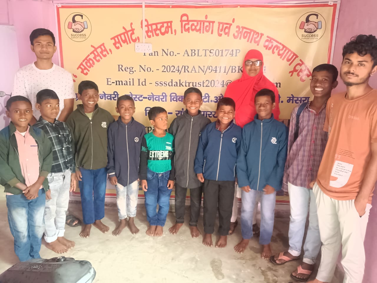 Caregiver hugging children at SuccessSupportSystem
Divyang & Anath Kalyan Trust home